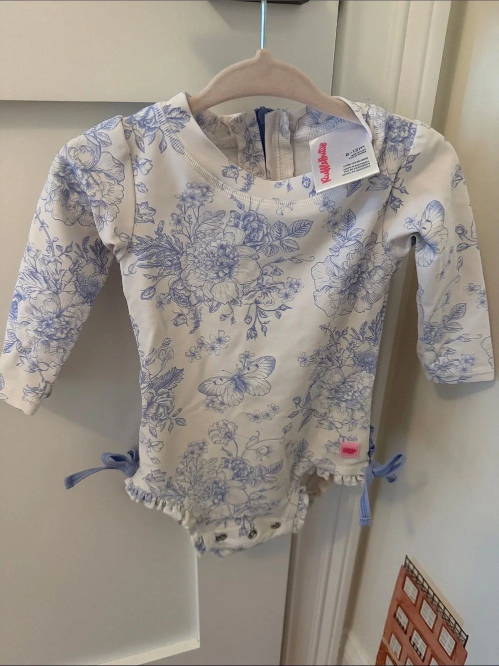 Ruffle Butts Cream and Blue Floral One-Piece with Bows